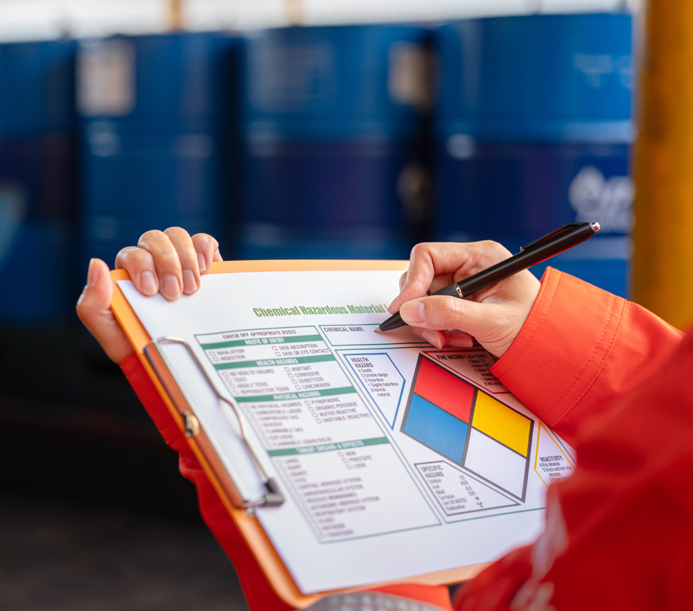 person holding clip board with regulations